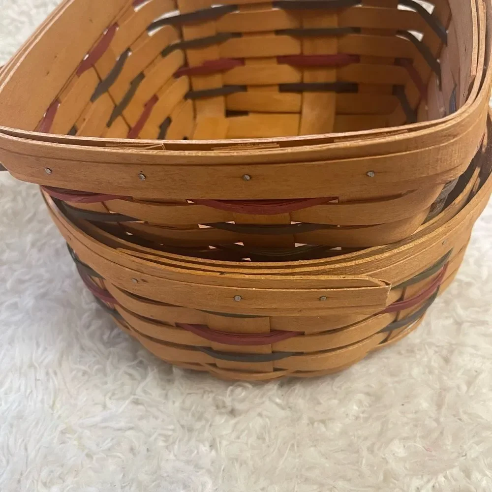 Longaberger 1995 set of two Handcrafted round and Square Woven baskets .